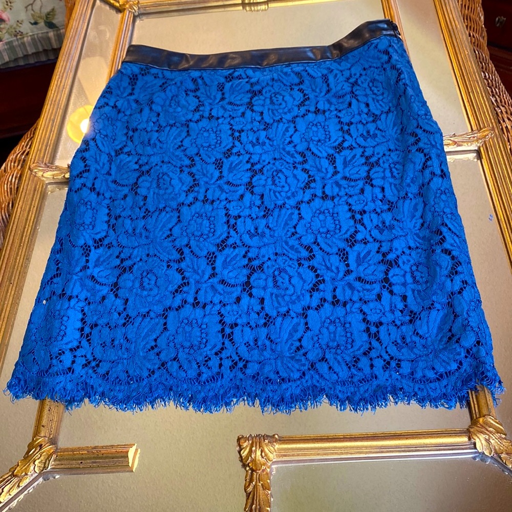 Beautiful vivid blue lace skirt with black leather waist band